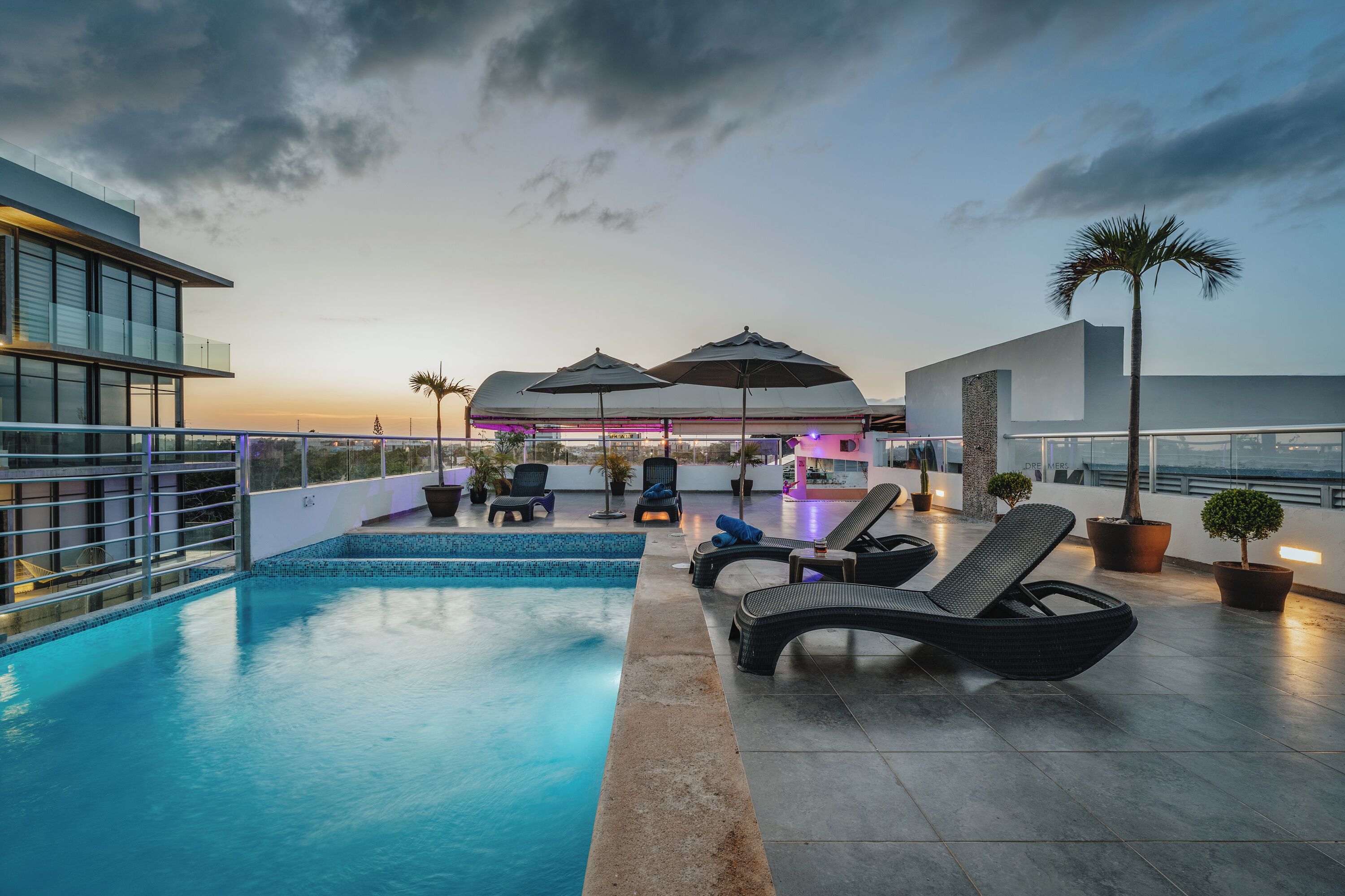 outdoor pool, open 9:00 am to 8:00 pm, pool umbrellas, pool loungers