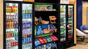 A 24/7 hot pizza vending machine with a variety of beverages and snacks. - ibis budget Southampton Centre (Southampton)