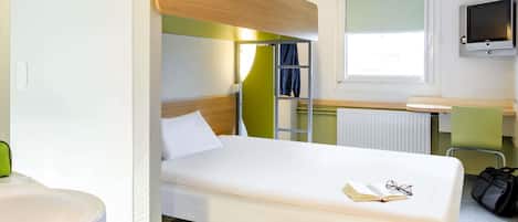 A bunk bed with a wooden headboard, a bedside table, a TV, and a window.
