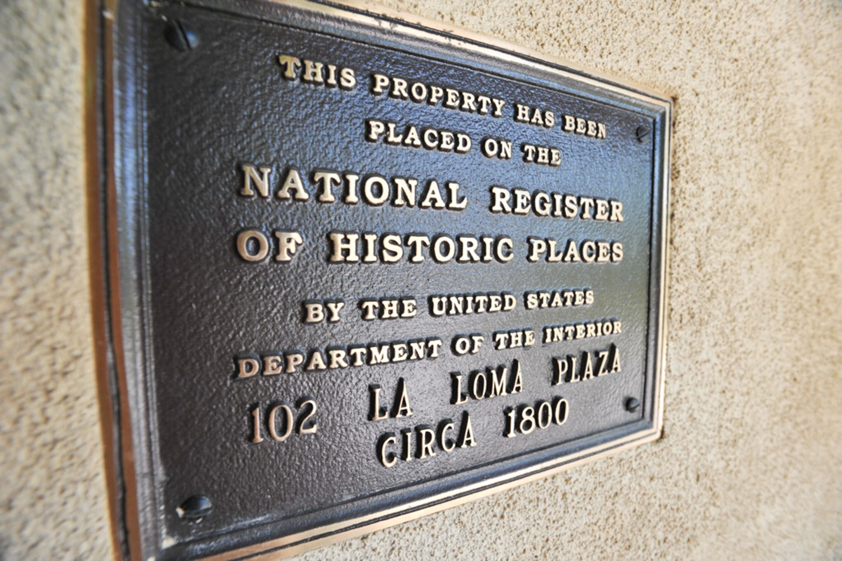 A plaque on a wall.