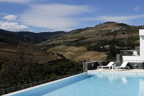 Seasonal outdoor pool, pool umbrellas, pool loungers