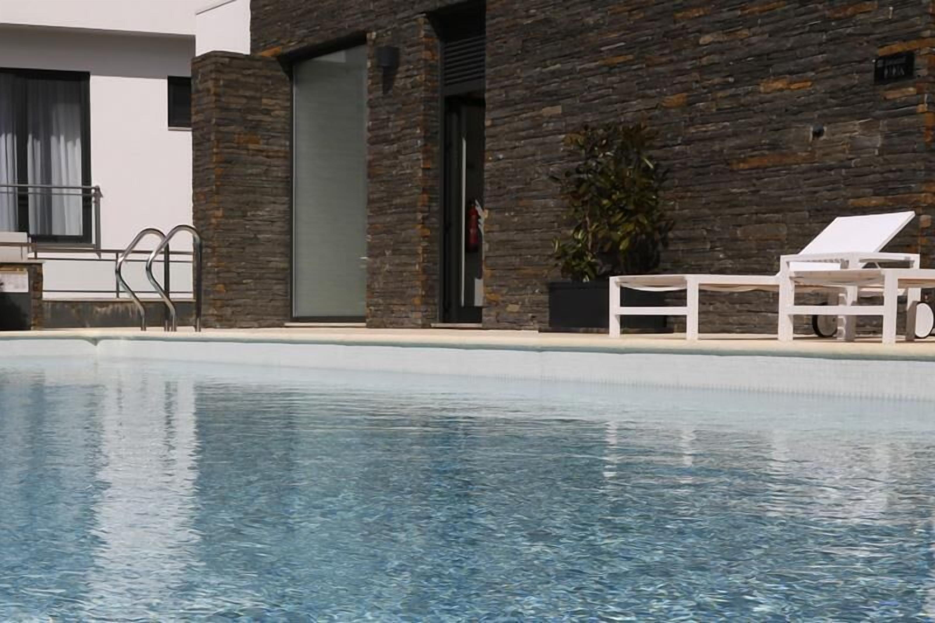 seasonal outdoor pool, pool umbrellas, pool loungers