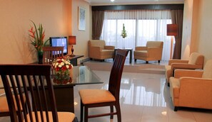 Living area | 21-inch LCD TV with cable channels, TV, fireplace - Hotel Danau Toba International (Medan)