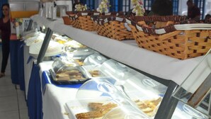 A buffet setup with various food items and baskets.