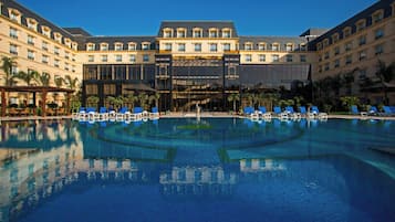 Outdoor pool, open 7:00 AM to 7:00 PM, pool loungers