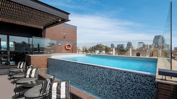 Seasonal outdoor pool, pool umbrellas, pool loungers