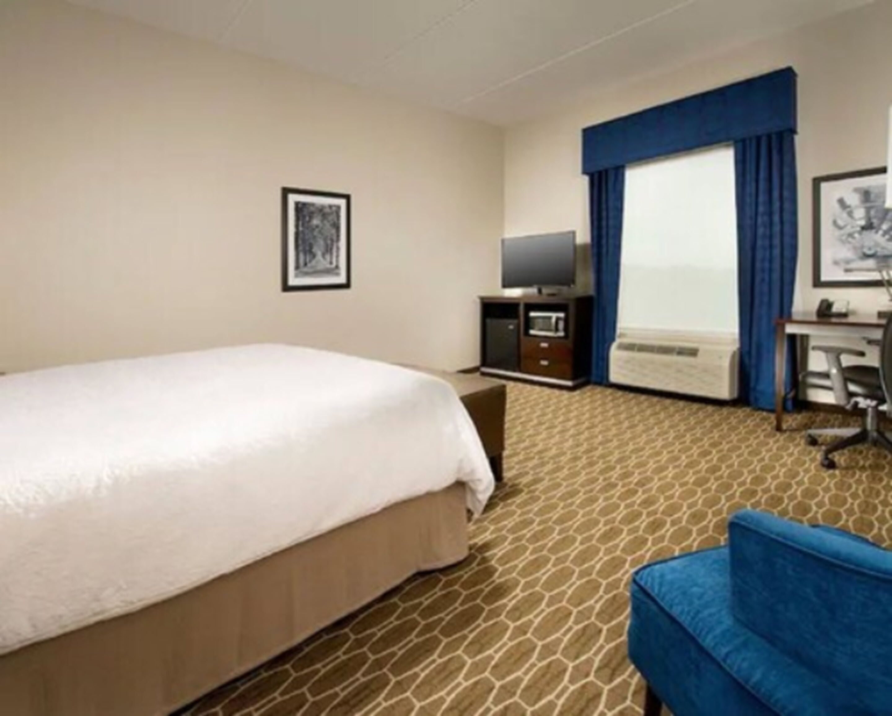 premium bedding, desk, laptop workspace, blackout curtains