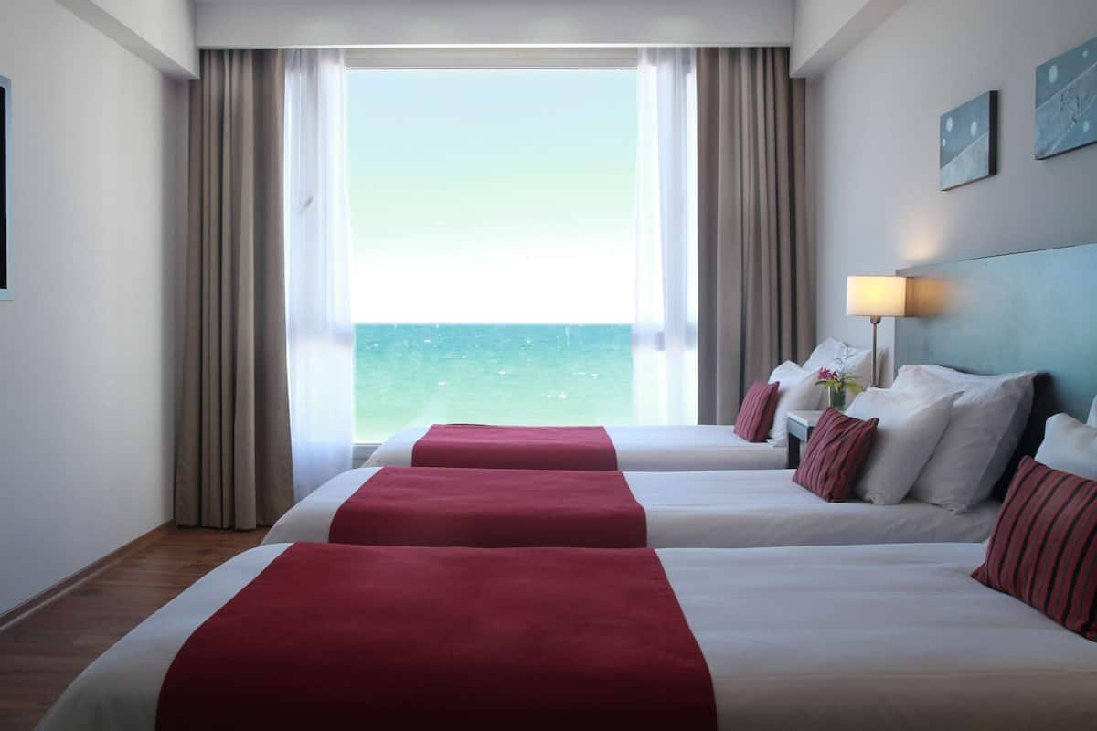 Room, 3 Twin Beds, Non Smoking, Ocean View | Minibar, in-room safe, desk, soundproofing