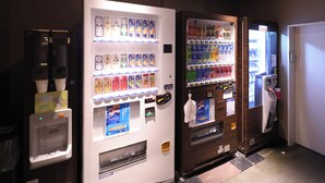 A row of vending machines with various beverages and snacks. - Dormy Inn Sendai ANNEX Natural Hot Spring (Sendai)