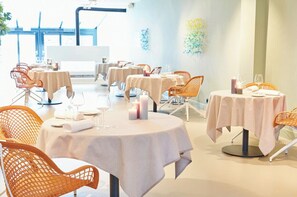 Breakfast, lunch, dinner served; Modern European cuisine, garden views 