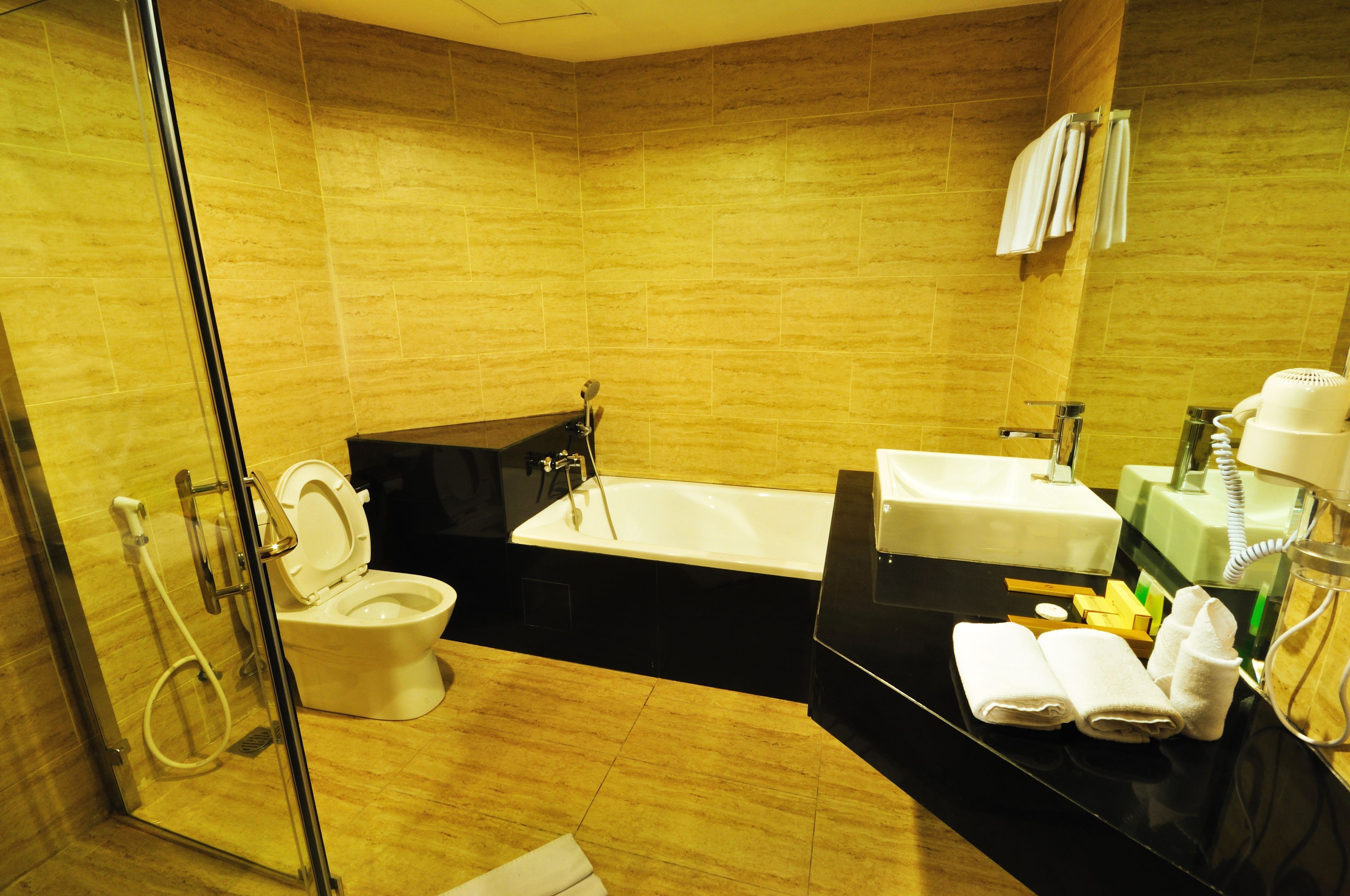 Bathroom | Combined shower/bathtub, free toiletries, hair dryer, slippers