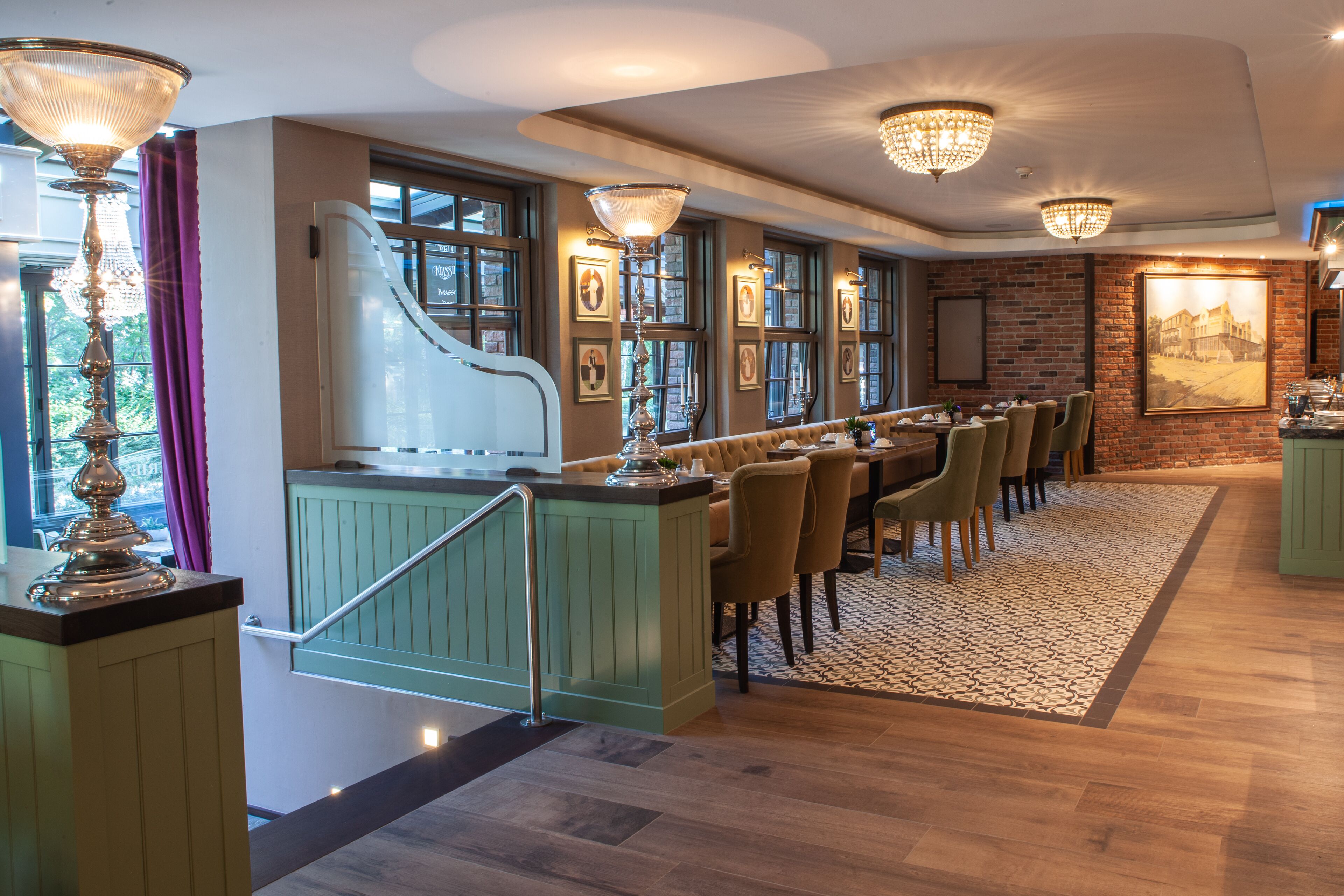 A dining area with a long counter, chairs, and a piano.