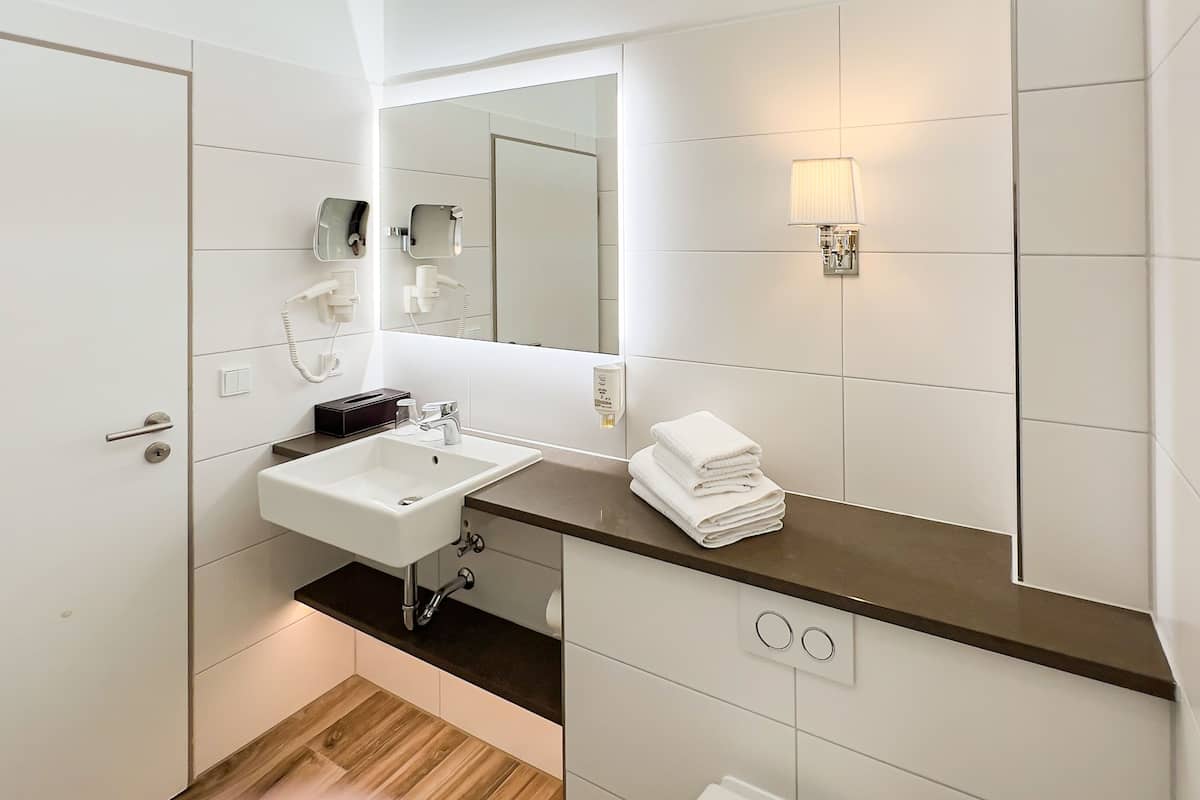 hair dryer, bathrobes, slippers, towels