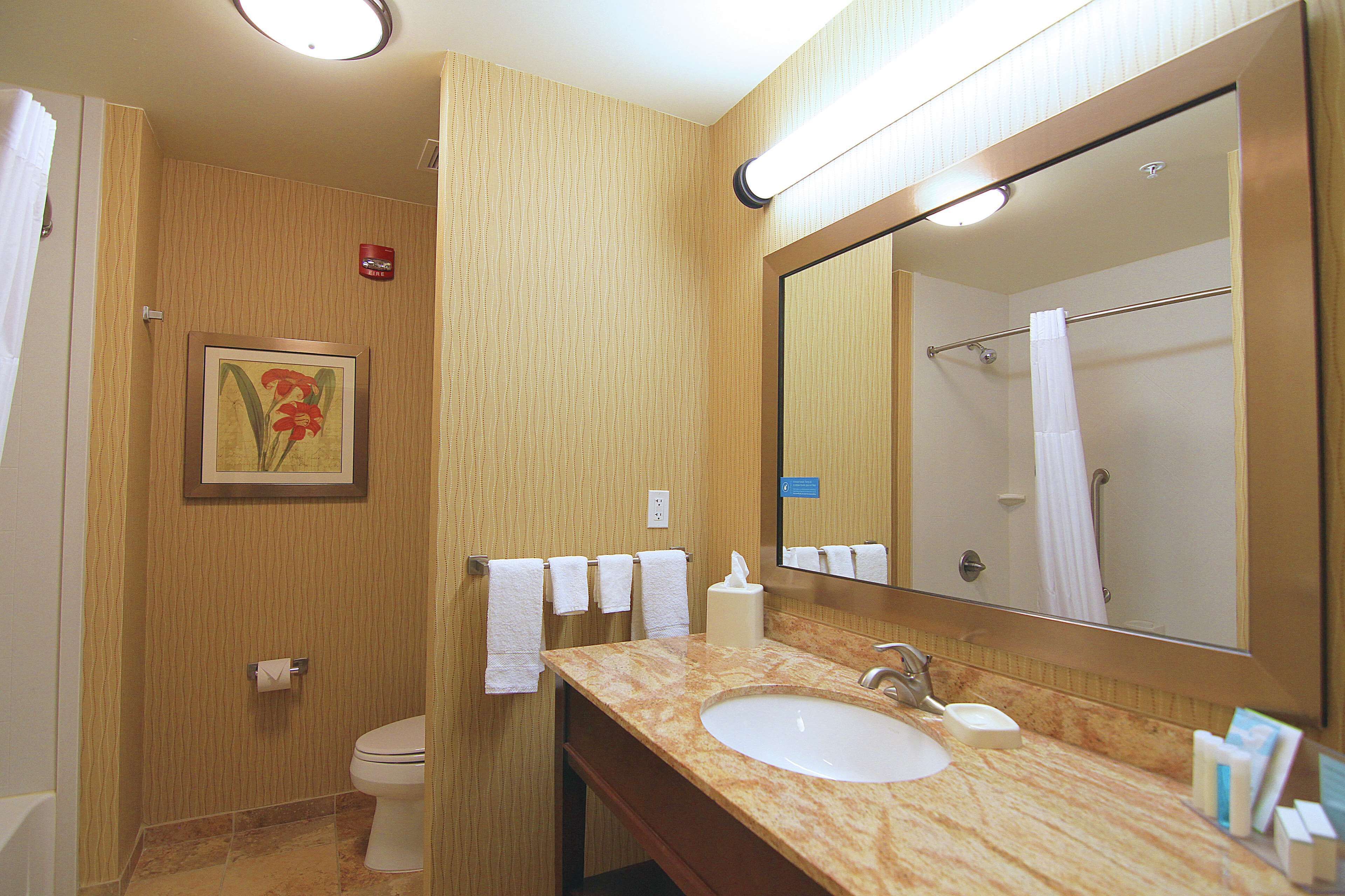 designer toiletries, hair dryer, towels