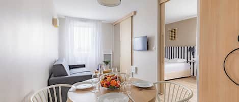 Apartment, 1 Bedroom | Living area | Flat-screen TV