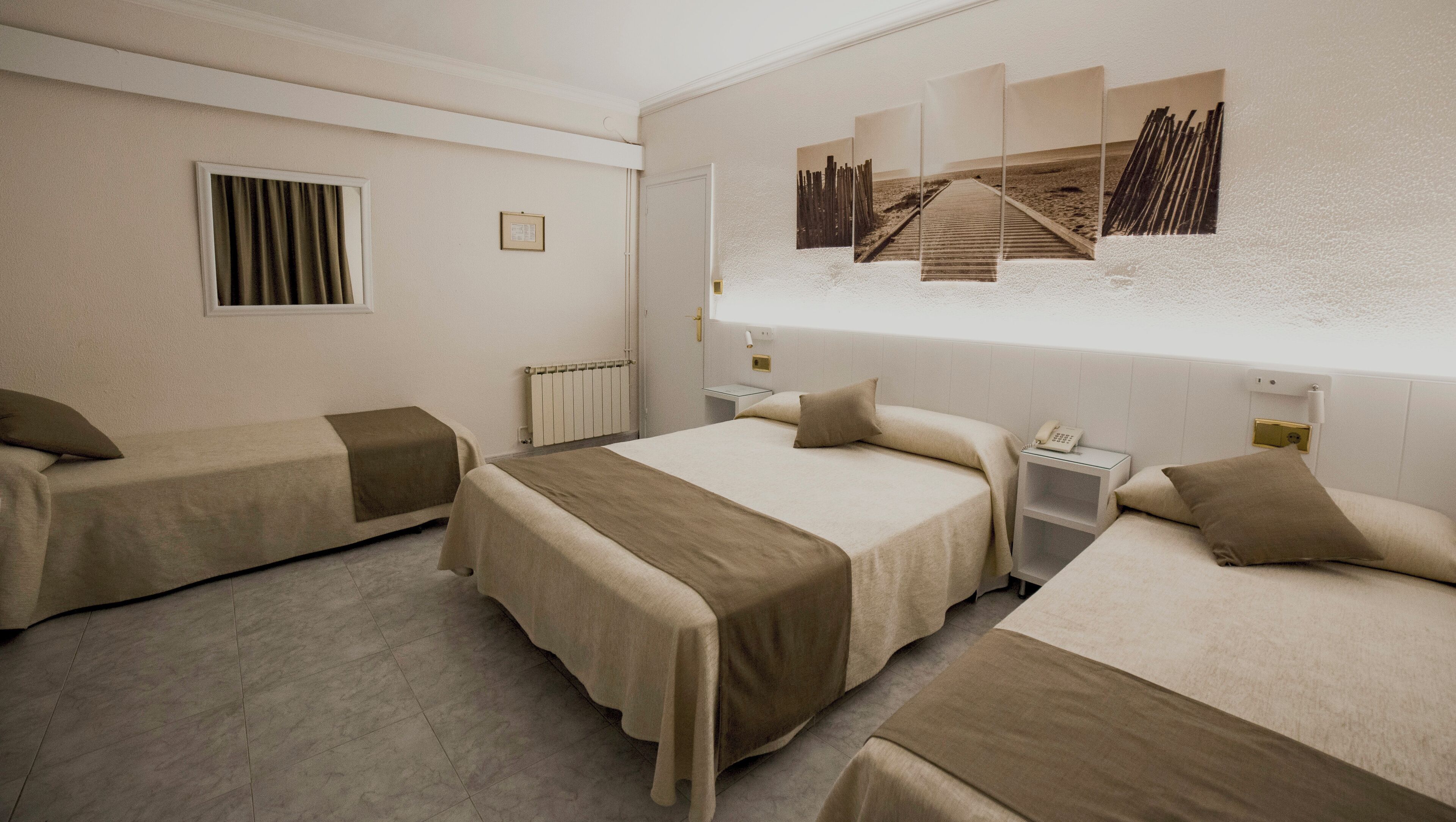 Quadruple Room | Minibar, in-room safe, desk, free WiFi