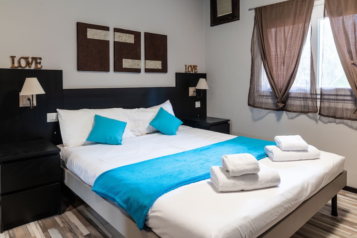 Family Apartment, 1 Bedroom | In-room safe, blackout curtains, iron/ironing board, free WiFi