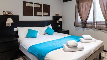 Appartement familial, 1 chambre | Coffre-fort, rideaux d’obscurcissement, fer et planche à repasser