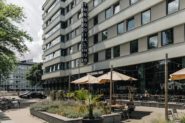 A modern building with a sign reading "The Social Hub".