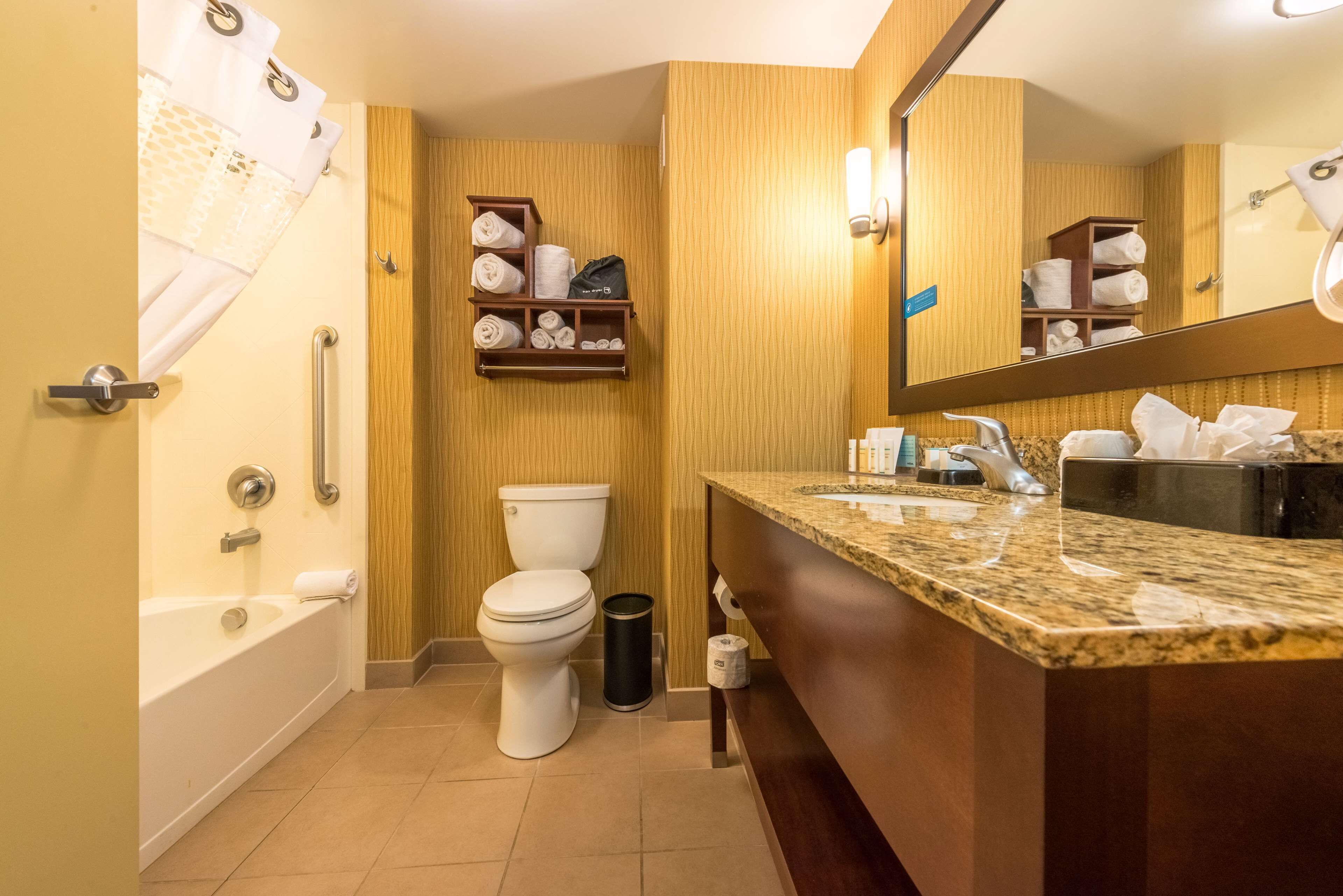 two queen beds | bathroom | combined shower/bathtub, free toiletries, towels