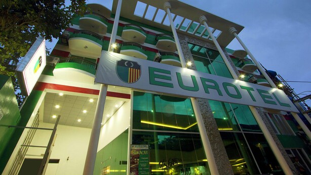 A hotel with a prominent sign reading "EUROTEEL" and a balcony with railings. - Eurotel Boracay (Boracay Island)