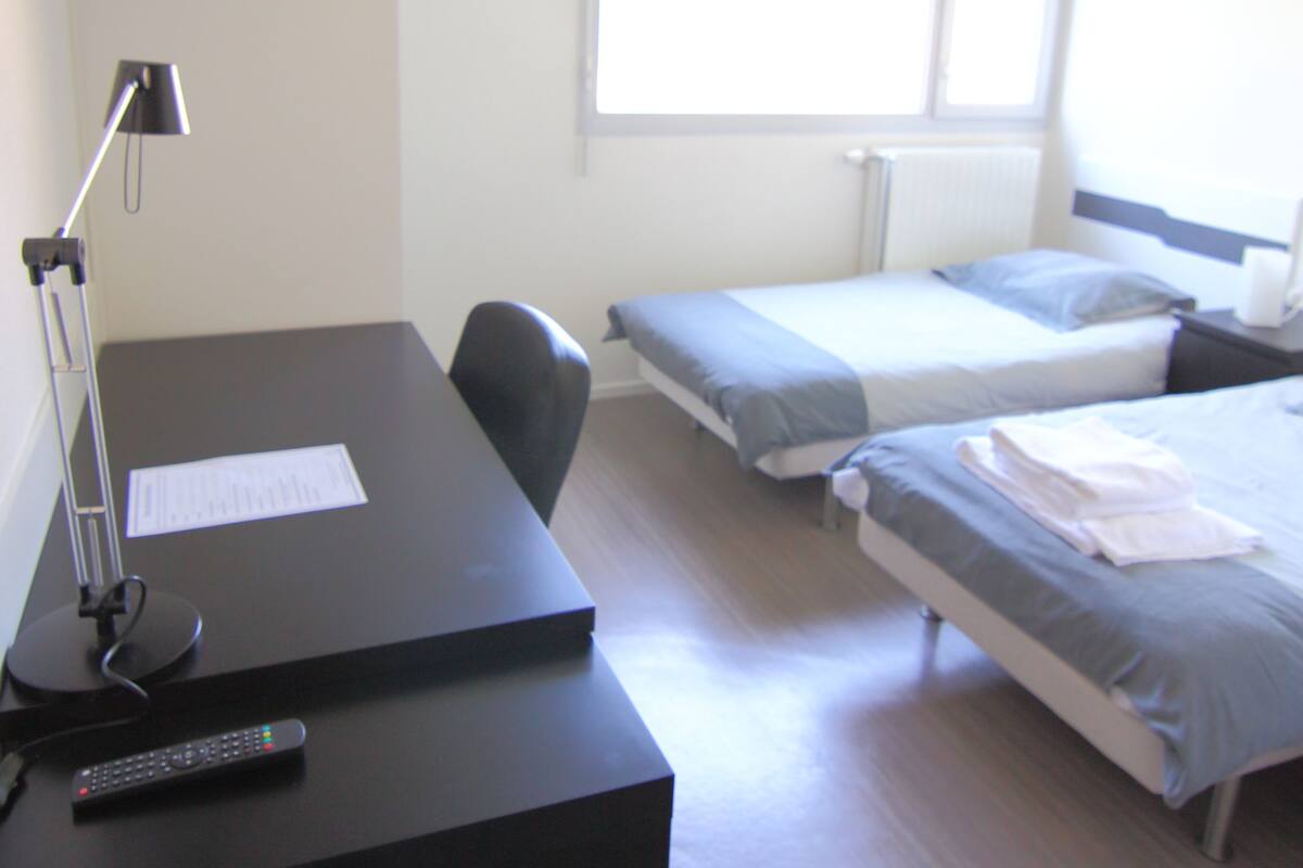 Twin Room | Desk, blackout drapes, iron/ironing board (on request)