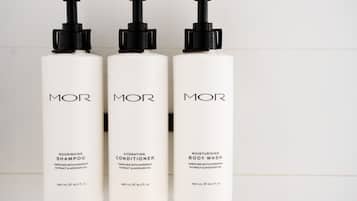 Three white bottles with black pumps, labeled 'MOR', each containing 480 mL of product.