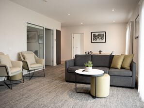 Three Bedroom Apartment | Living area | 55-inch LCD TV with digital channels, TV, books - Quest Wodonga (Wodonga)