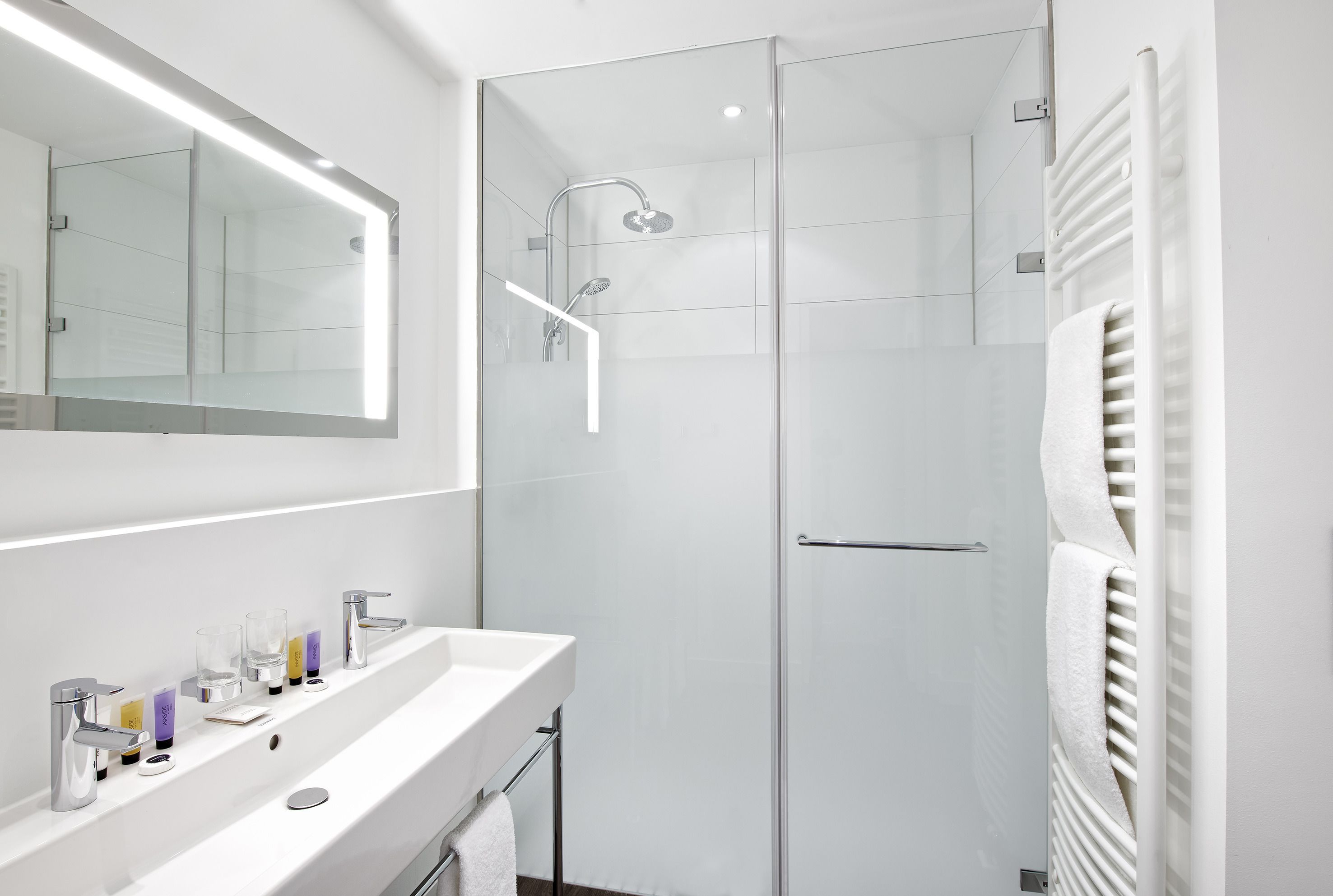 innside lifestyle suite | bathroom | shower, rainfall showerhead, eco-friendly toiletries, hair dryer
