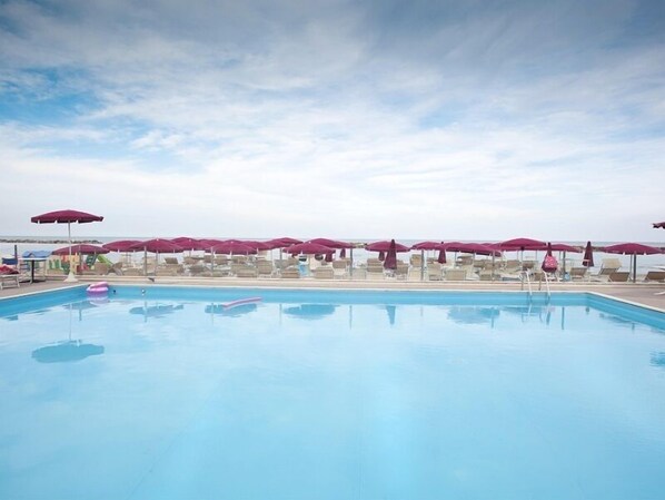 Outdoor pool, open 10:00 AM to 6:00 PM, pool umbrellas, pool loungers