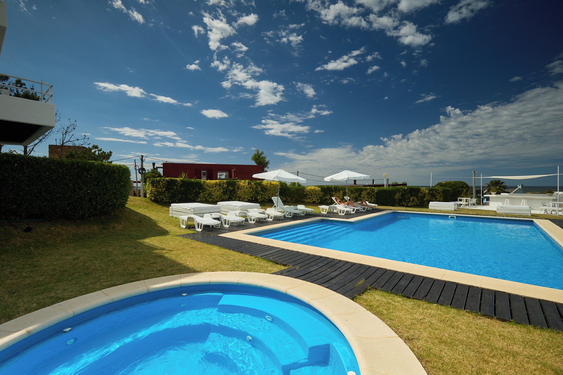 Seasonal outdoor pool, pool umbrellas, pool loungers