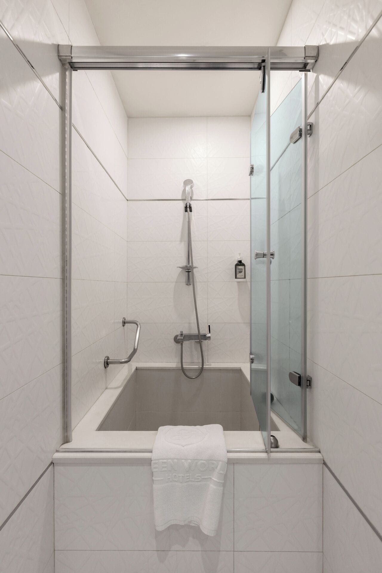 budget room, 1 single bed, no windows | bathroom | hair dryer, towels