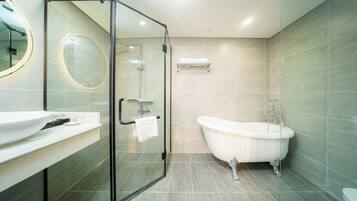 Suite, 1 King Bed | Bathroom | Combined shower/tub, deep soaking tub, rainfall showerhead