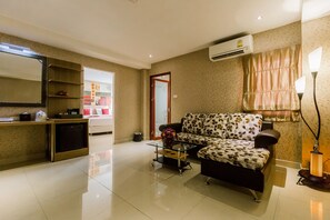 Junior suite | Woonruimte | Een lcd-televisie