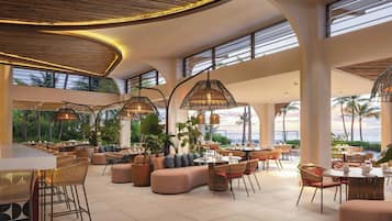 On the beach, white sand, sun-loungers, beach umbrellas