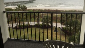 A balcony with a view of the ocean and a pier. - Bermuda Sands on the Boardwalk (Myrtle Beach)