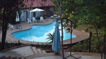 Outdoor pool, pool umbrellas, sun loungers