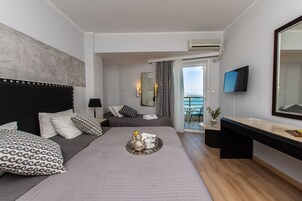 Triple Room, Sea View | In-room safe, desk, blackout drapes, free cribs/infant beds