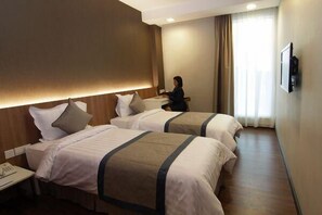 Deluxe Room | Minibar, in-room safe, iron/ironing board, free WiFi