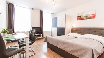 Apartment, 1 Bedroom | Iron/ironing board, free cribs/infant beds, free WiFi, bed sheets