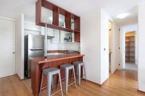 Family Apartment, 2 Bedrooms | Private kitchen | Fridge, microwave, oven, coffee/tea maker - Bellavista Apartments (Santiago)