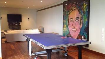 Relax in style with a ping pong table and comfortable seating area.