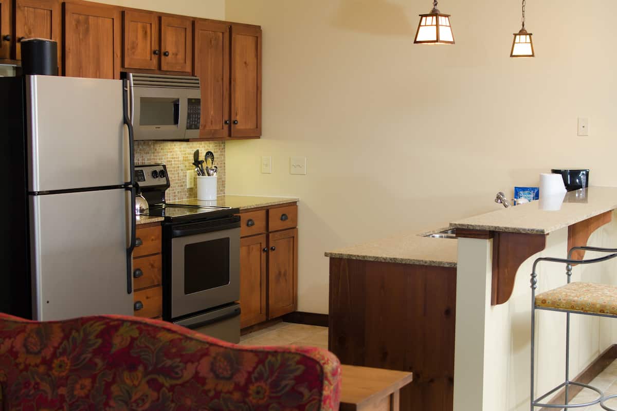 Two Bedroom Condo Deluxe | Living area | TV, fireplace