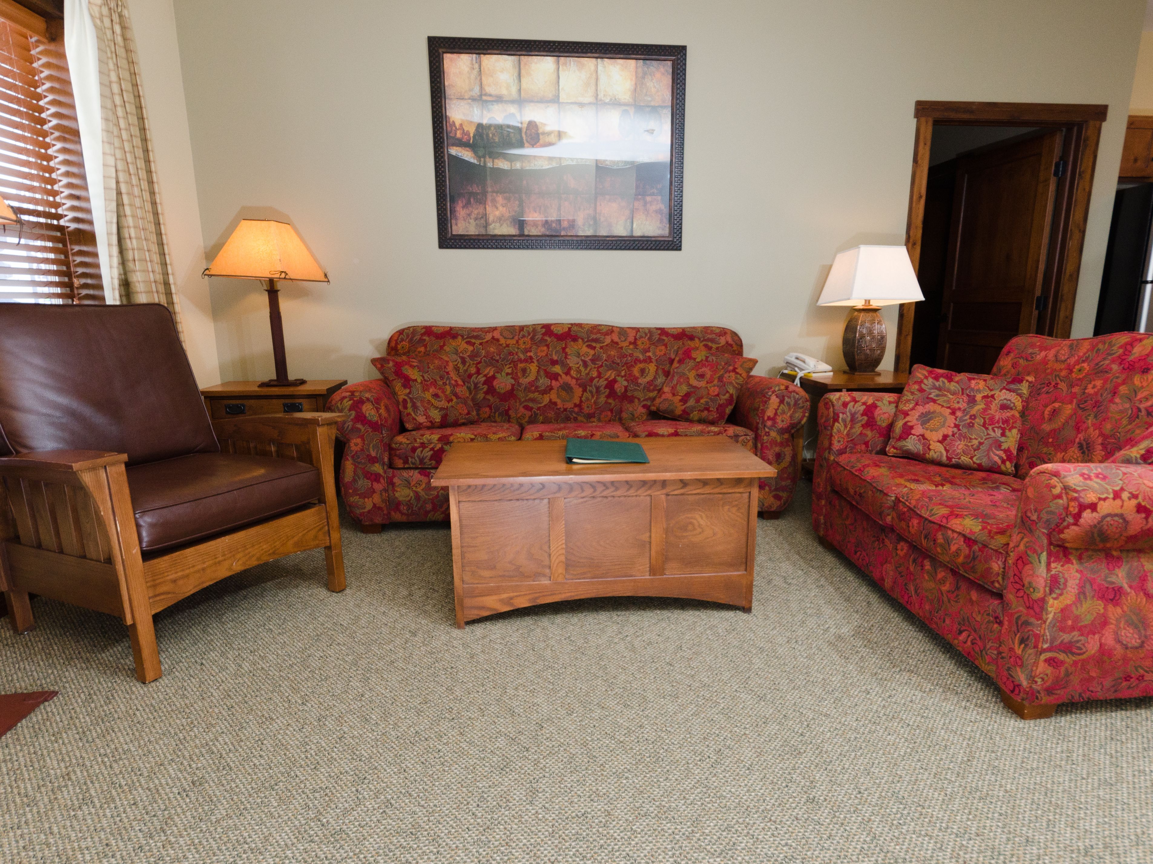 two bedroom condo deluxe | living room | tv, fireplace