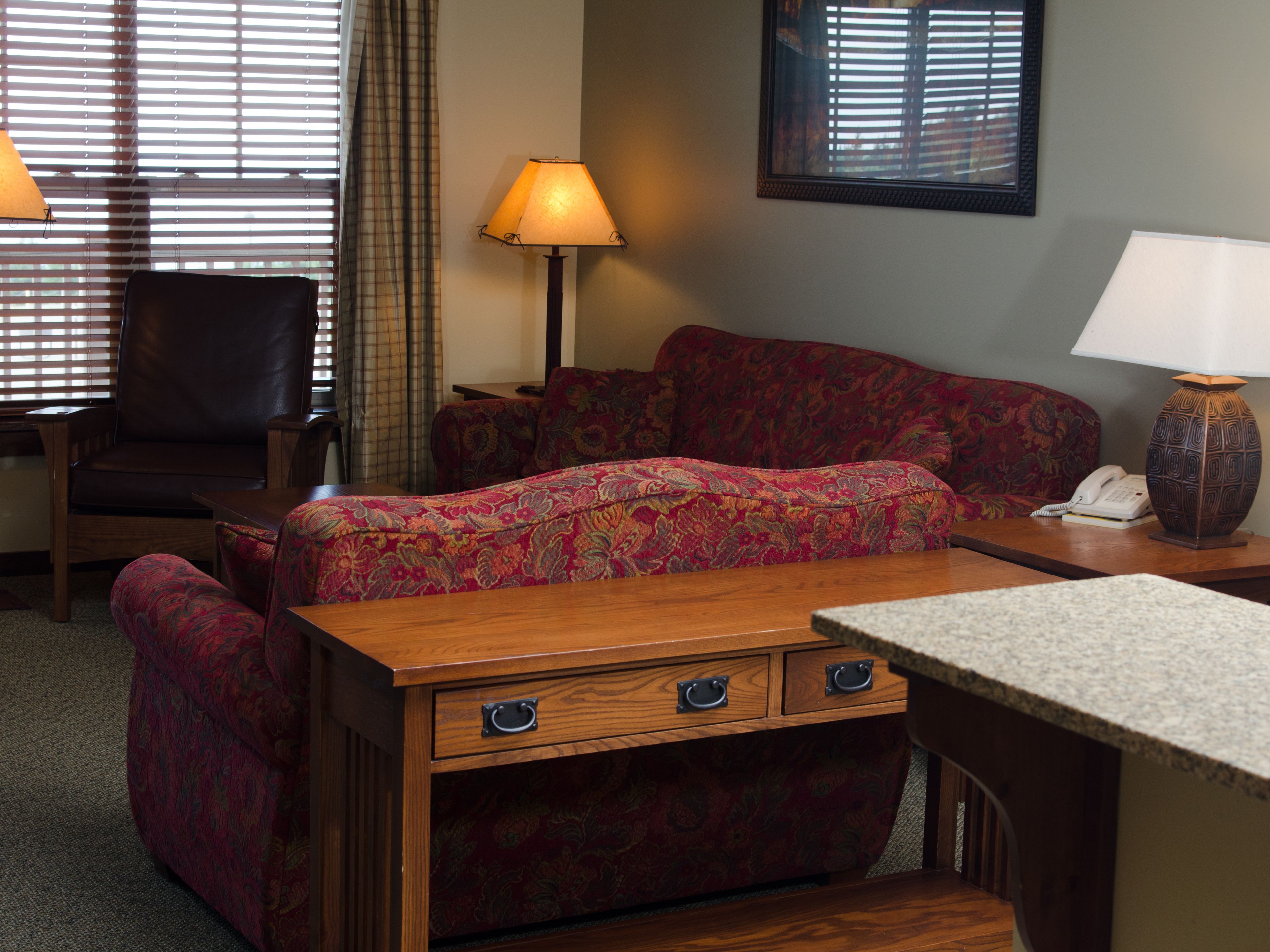 two bedroom condo deluxe | living area | tv, fireplace