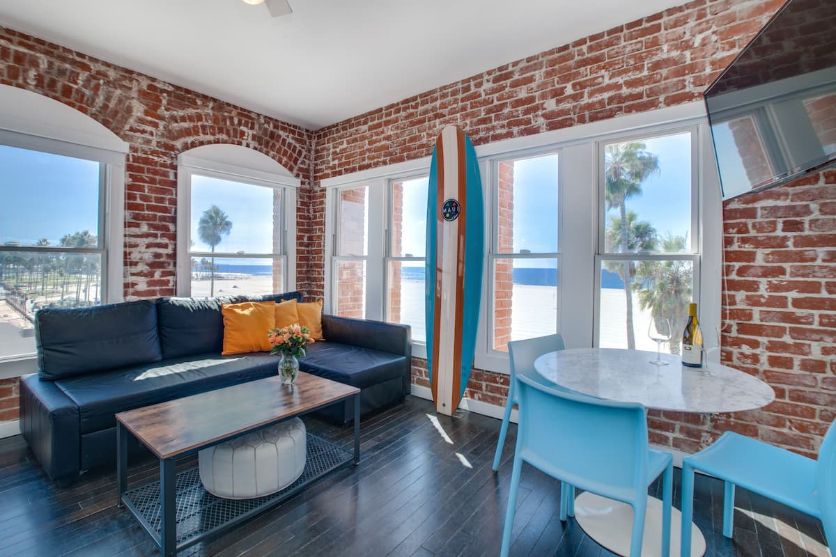 Suite, 1 Bedroom, Ocean View, Beachfront | Living area | 28-inch flat-screen TV with cable channels, TV