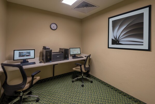 A room with a desk, two monitors, a printer, and a chair. - Candlewood Suites Midwest City by IHG (Del City)