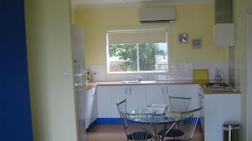 Full-sized fridge, microwave, stovetop, coffee/tea maker