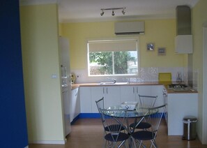 Full-sized fridge, microwave, stovetop, coffee/tea maker