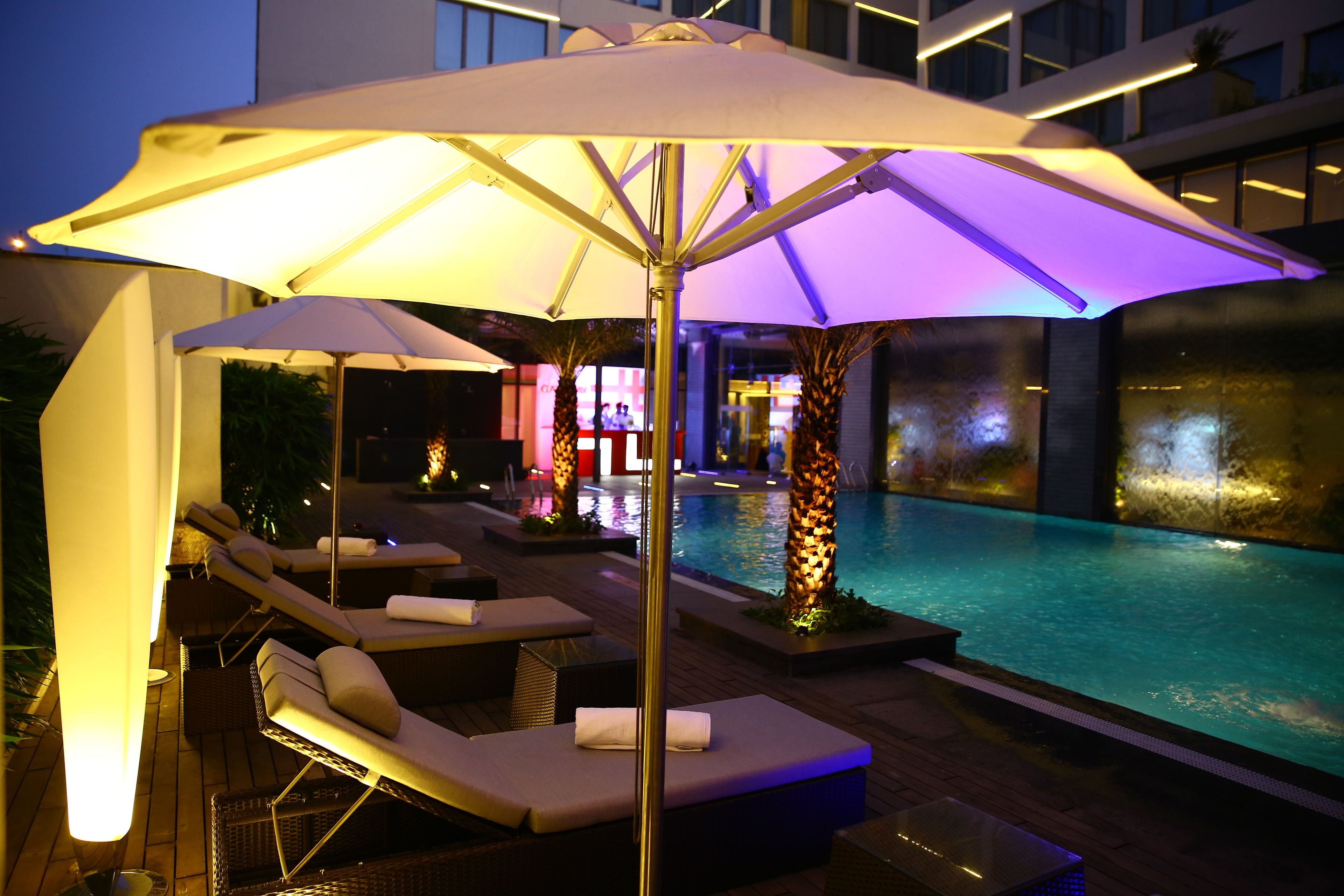outdoor pool, pool umbrellas, pool loungers